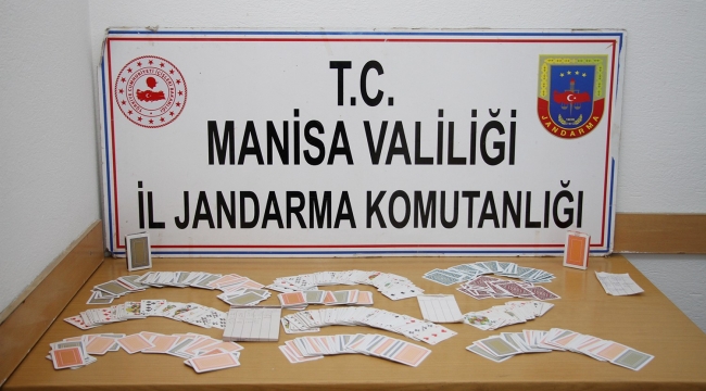 Kula İlçe Jandarmadan kumar baskını: 15 kişi kumar oynarken yakalandı