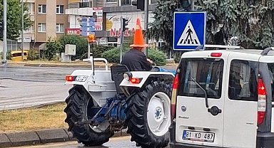Bolu'da traktör sürücüsünden yağmura karşı 'dubalı' önlem