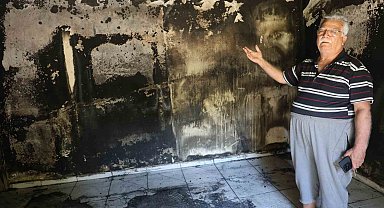 Yaşlı çiftin alevlere teslim olan 40 yıllık evlerinden geriye camı renklendiren çiçekleri kaldı