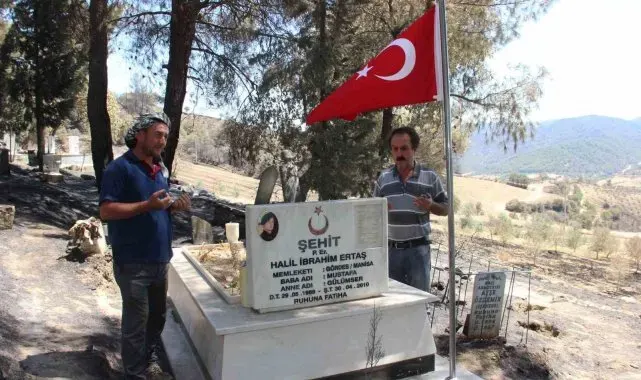 Yangında şehit mezarı yanmadı