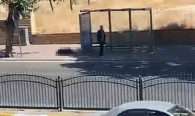 Durakta bekleyen eşini silahla vurdu