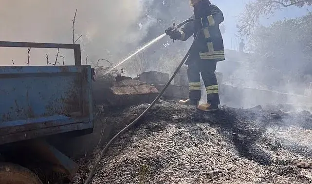 Altınözü'nde bahçede çıkan yangın römorka sıçradı
