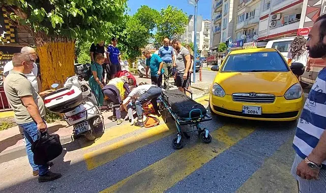 Efeler'de yolun karşısına geçmek isteyen kadına taksi çarptı: 1 yaralı