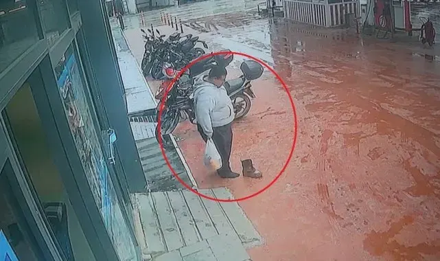 Çamurlu ayakkabısını çıkartıp, market alışverişini öyle yaptı o anlar kamerada